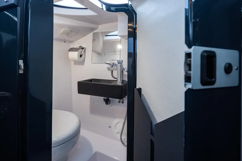 Slide: The Image of Compact bathroom in 2023 Arksen 30 Adventure yacht, featuring modern sink and toilet. - 14