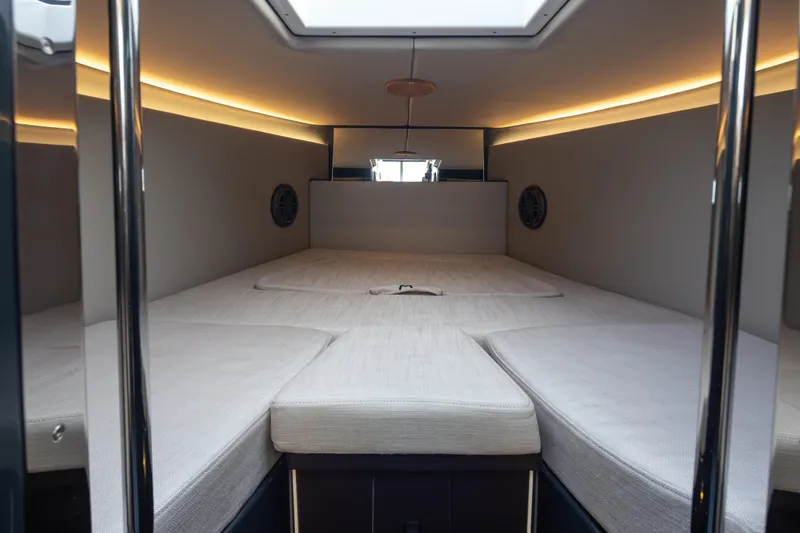 Slide: The Image of Interior cabin of 2023 Arksen 30 Adventure boat with modern lighting and comfortable bedding. - 17