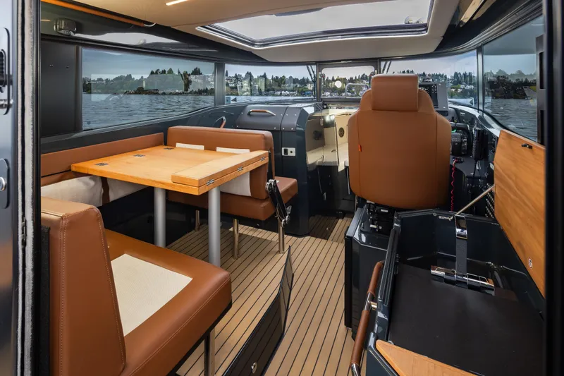 Slide: The Image of Interior of 2023 Arksen 30 Adventure boat with seating and navigation area. - 4