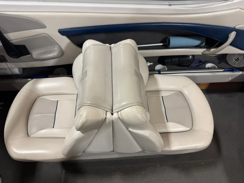Slide: The Image of Interior of a 1995 Four Winns 245 Sundowner boat with white leather seats. - 10
