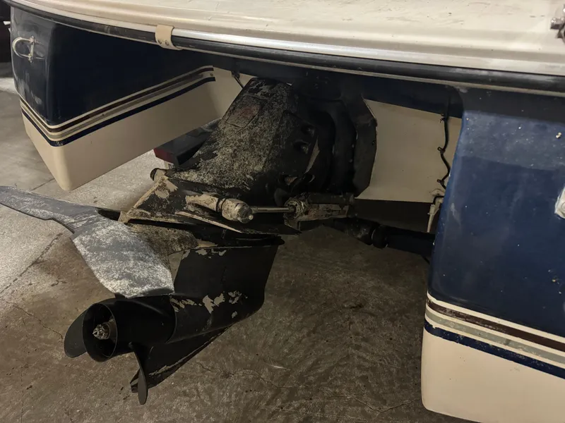 Slide: The Image of Rear view of a 1995 Four Winns 245 Sundowner boat with outboard motor. - 2