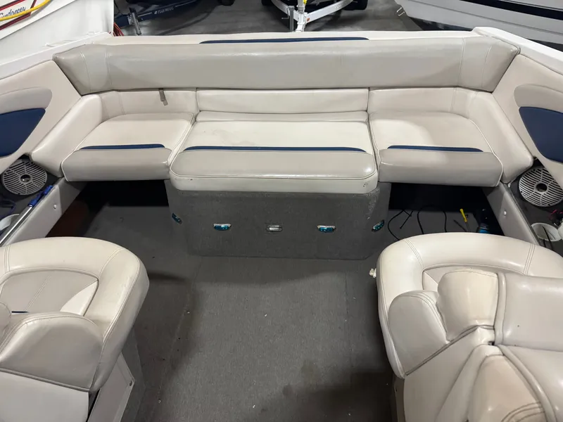 Slide: The Image of Interior of a 1995 Four Winns 245 Sundowner boat with seating area. - 4