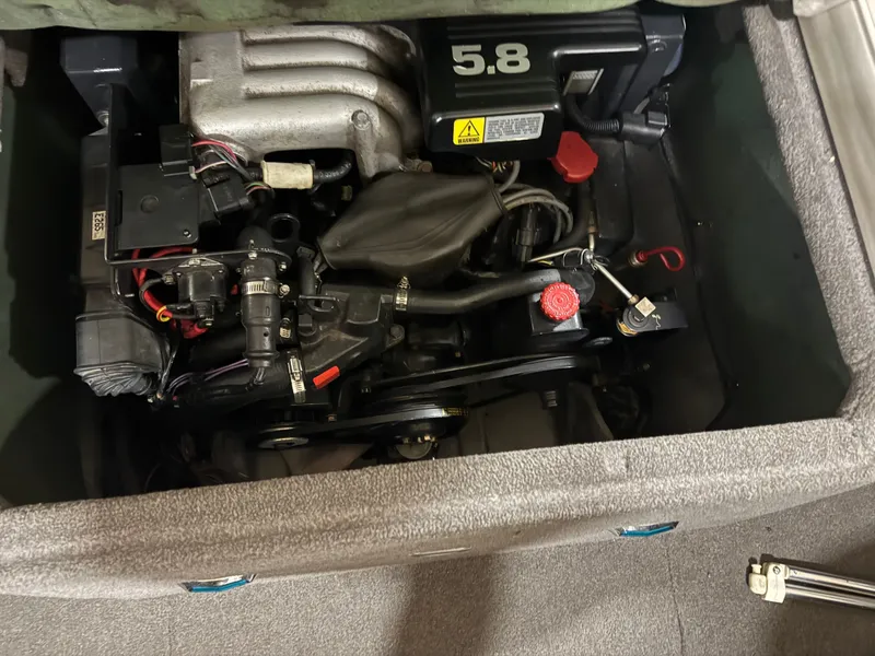 Slide: The Image of Engine compartment of a 1995 Four Winns 245 Sundowner boat. - 7