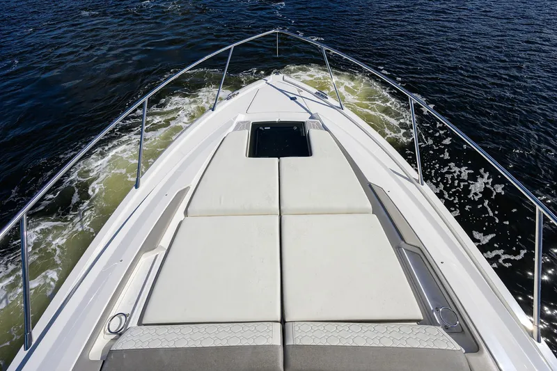 Slide: The Image of Bow view of 2022 Tiara Yachts 43 LE cruising on water. - 20