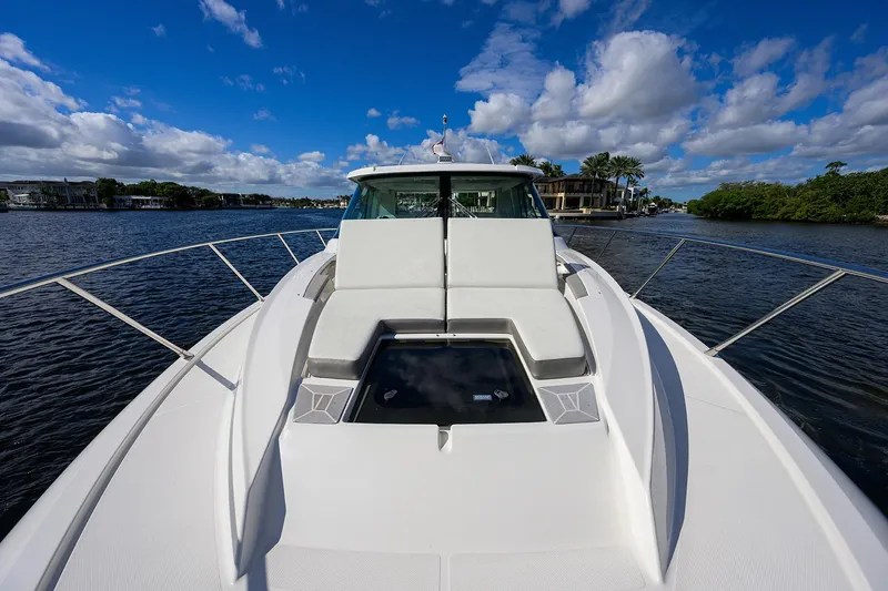 Slide: The Image of 2022 Tiara Yachts 43 LE on water, showcasing sleek design and luxury features. - 22