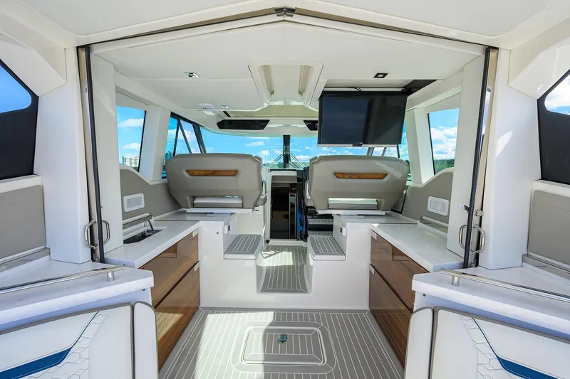 Slide: The Image of Interior of 2022 Tiara Yachts 43 LE, featuring modern seating and sleek design elements. - 3