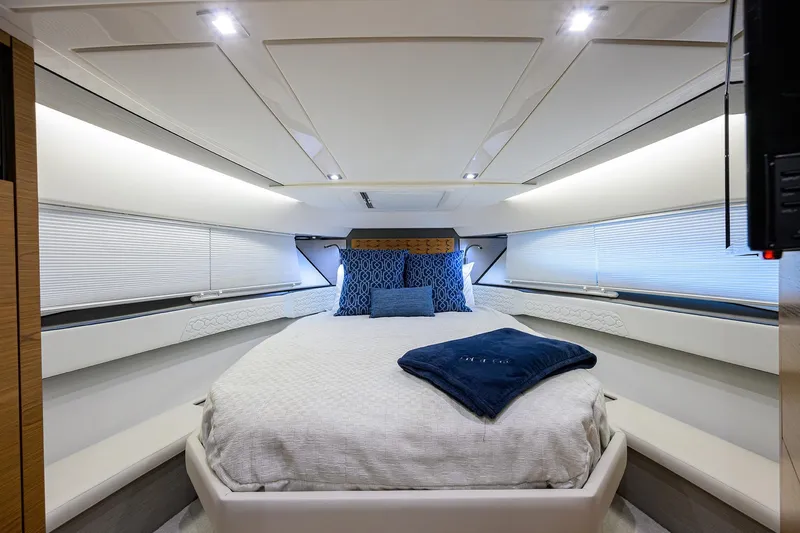 Slide: The Image of Luxurious interior of 2022 Tiara Yachts 43 LE, featuring a cozy, well-lit bedroom. - 40