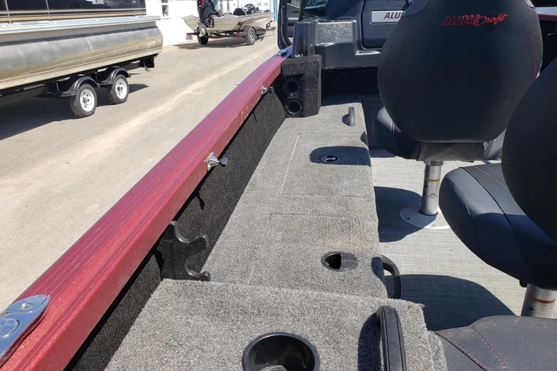 Slide: The Image of 2023 Alumacraft Competitor 175 Sport interior with seating and storage compartments. - 10