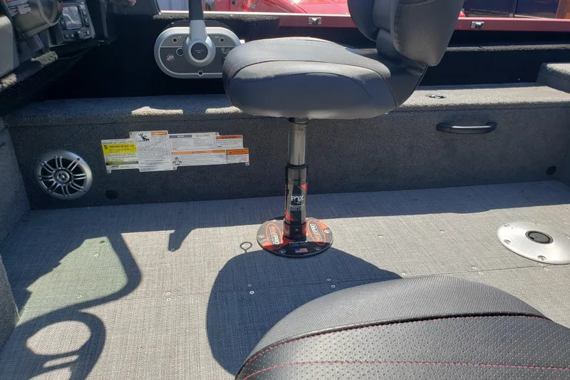 Slide: The Image of 2023 Alumacraft Competitor 175 Sport boat interior with seating and control panel. - 7