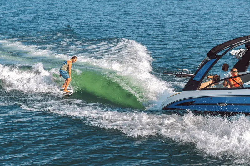 Slide: The Image of Surfer behind 2026 Sea Ray SDX 250 Surf on wave. - 11
