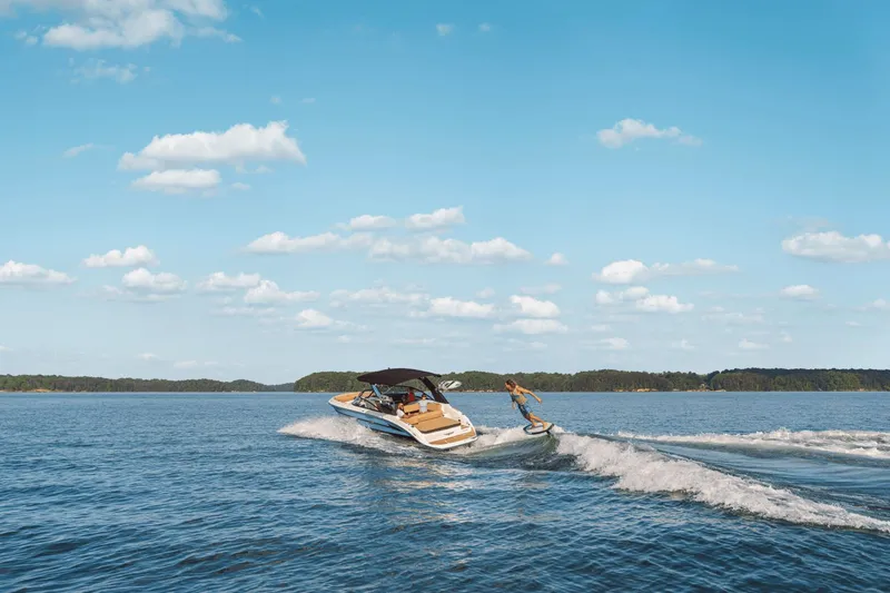 Slide: The Image of 2026 Sea Ray SDX 250 Surf on a lake with surfer. - 13
