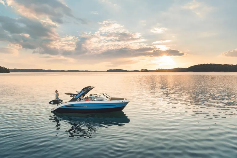 Slide: The Image of 2026 Sea Ray SDX 250 Surf on calm water at sunset. - 33