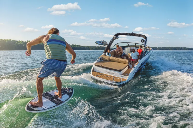 Slide: The Image of Surfer behind a Sea Ray SDX 250 Surf boat, 2026 model. - 5