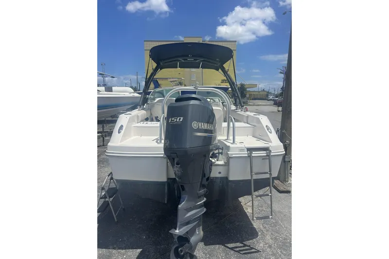 Slide: The Image of 2014 Robalo R207 Dual Console boat with Yamaha 150 engine, parked outdoors. - 15