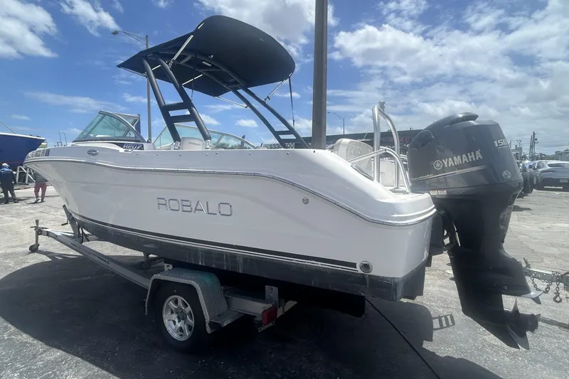 Slide: The Image of 2014 Robalo R207 Dual Console boat on trailer with Yamaha outboard motor. - 5