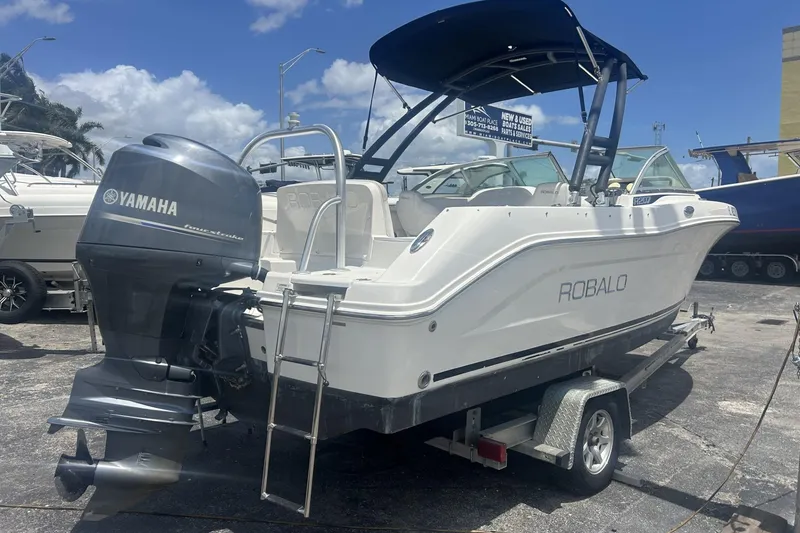Slide: The Image of 2014 Robalo R207 Dual Console boat with Yamaha engine on trailer. - 6