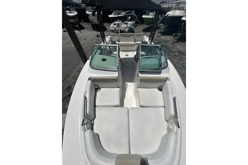 Slide: The Image of 2014 Robalo R207 Dual Console boat with spacious seating and open deck layout. - 8