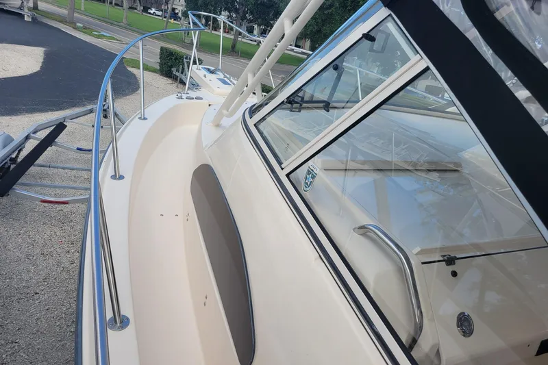 Slide: The Image of 2023 Grady-White Marlin 300 boat deck with railing and windows. - 13
