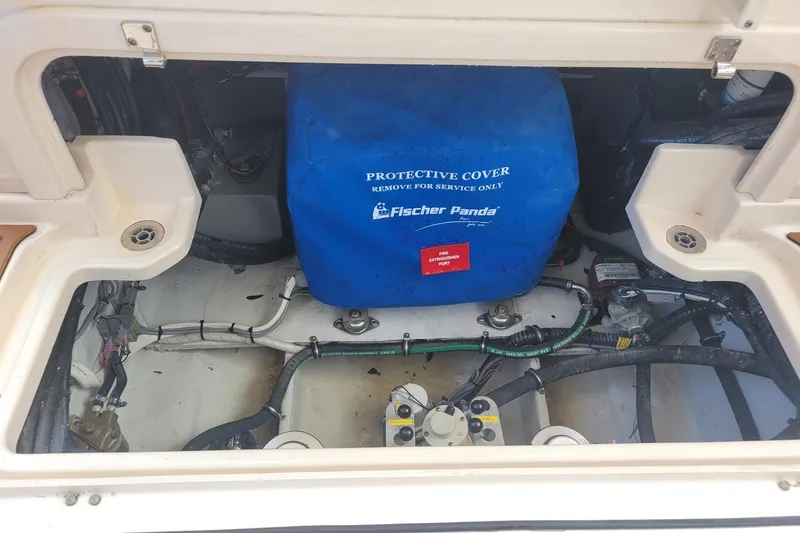 Slide: The Image of Engine compartment of 2023 Grady-White Marlin 300 with Fischer Panda generator cover. - 17