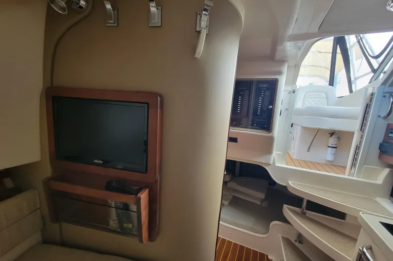 Slide: The Image of Interior of 2023 Grady-White Marlin 300 boat with TV and seating area. - 25