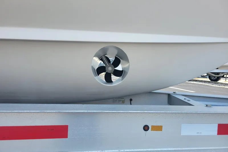 Slide: The Image of 2023 Grady-White Marlin 300 boat hull with visible propeller detail on trailer. - 4