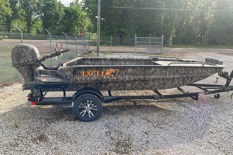 The Image of 2026 Excel 1651 Viper F4 boat on trailer, camouflage design, parked outdoors. - 0