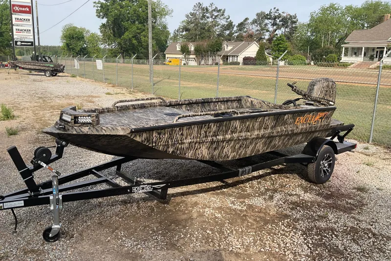 Slide: The Image of 2026 Excel 1651 Viper F4 boat with camouflage design on a trailer. - 2