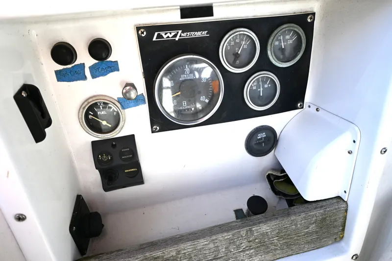 Slide: The Image of Instrument panel of a 1980 Tartan 37 sailboat with gauges and controls. - 23