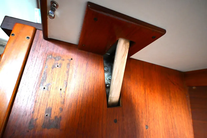 Slide: The Image of Wooden interior detail of a 1980 Tartan 37 sailboat, showcasing craftsmanship and design. - 53