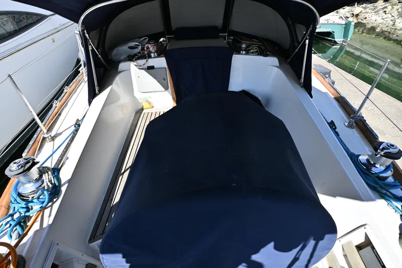 Slide: The Image of Cockpit of a 1980 Tartan 37 sailboat with blue covers and winches. - 19