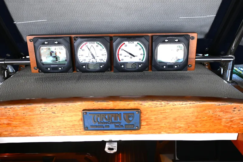Slide: The Image of Instrumentation panel on a 1980 Tartan 37 sailboat, featuring depth and wind gauges. - 29