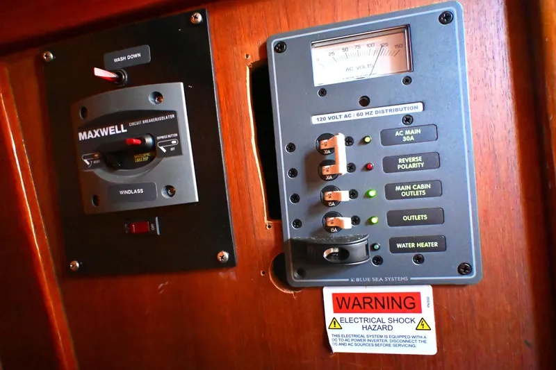 Slide: The Image of Electrical panel on 1980 Tartan 37 boat with circuit breakers and warning label. - 38