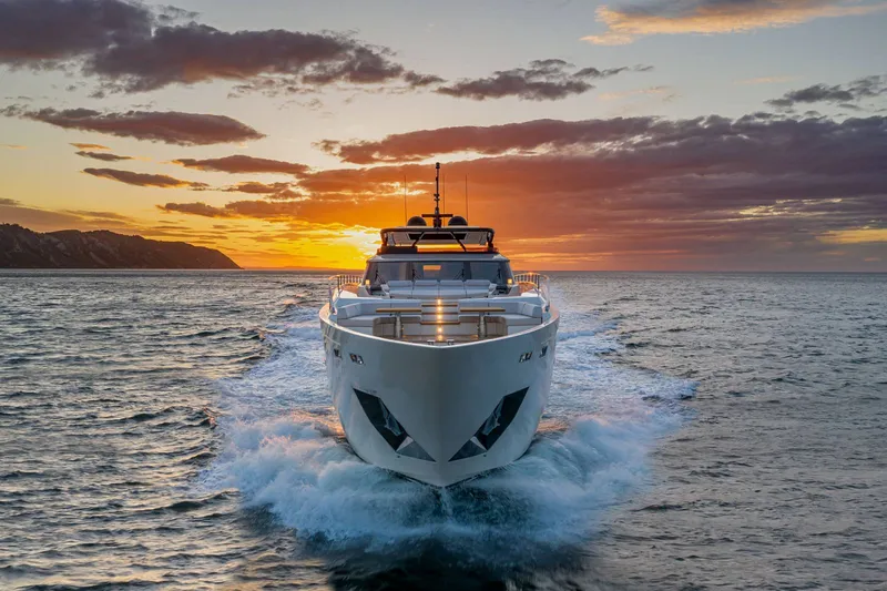 Slide: The Image of 2027 Ferretti Yachts 1000 cruising at sunset on the ocean. - 3