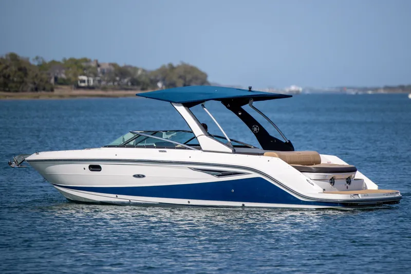 Slide: The Image of 2022 Sea Ray SLX 280 boat on calm water, featuring sleek design and blue accents. - 10