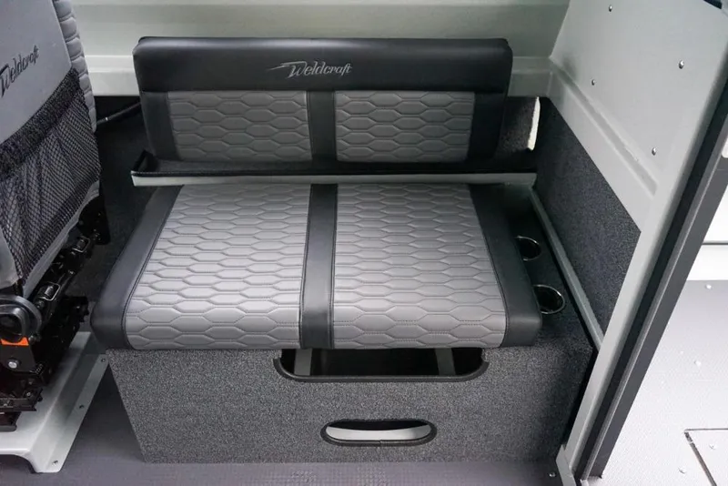 Slide: The Image of 2026 Weldcraft 220 Ocean King interior seating with gray upholstery and cup holders. - 11