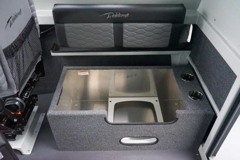 Slide: The Image of Interior of 2026 Weldcraft 220 Ocean King boat with seating and storage compartment. - 12