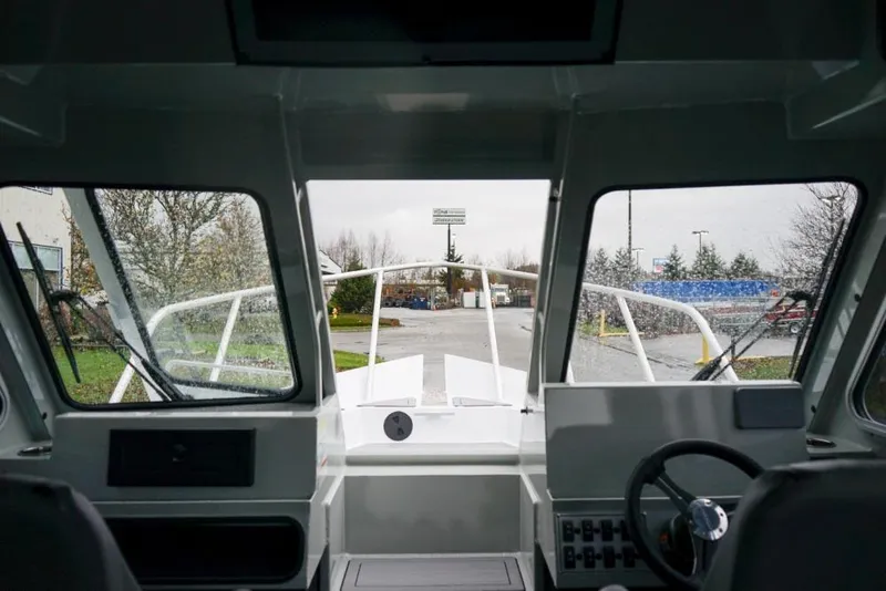 Slide: The Image of Interior view of 2026 Weldcraft 220 Ocean King boat cockpit with windshield. - 17