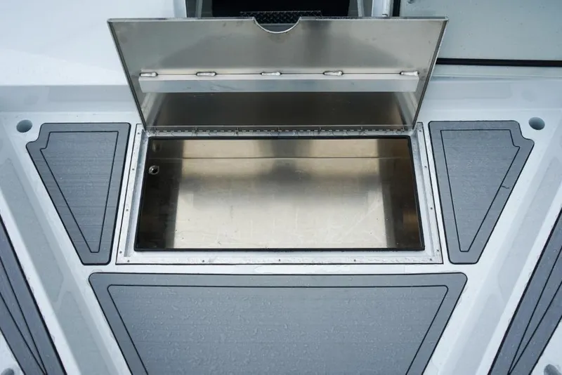Slide: The Image of Open storage compartment on 2026 Weldcraft 220 Ocean King boat deck. - 19