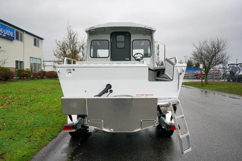 Slide: The Image of 2026 Weldcraft 220 Ocean King boat, rear view on a rainy day. - 5