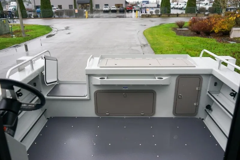 Slide: The Image of 2026 Weldcraft 220 Ocean King boat interior with storage compartments and seating. - 7