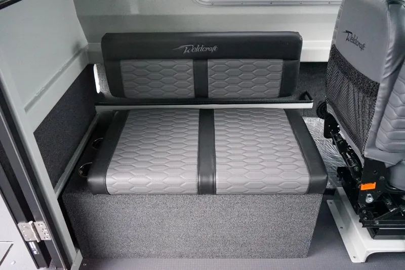 Slide: The Image of 2026 Weldcraft 220 Ocean King interior seating with gray upholstery and hexagonal pattern. - 9