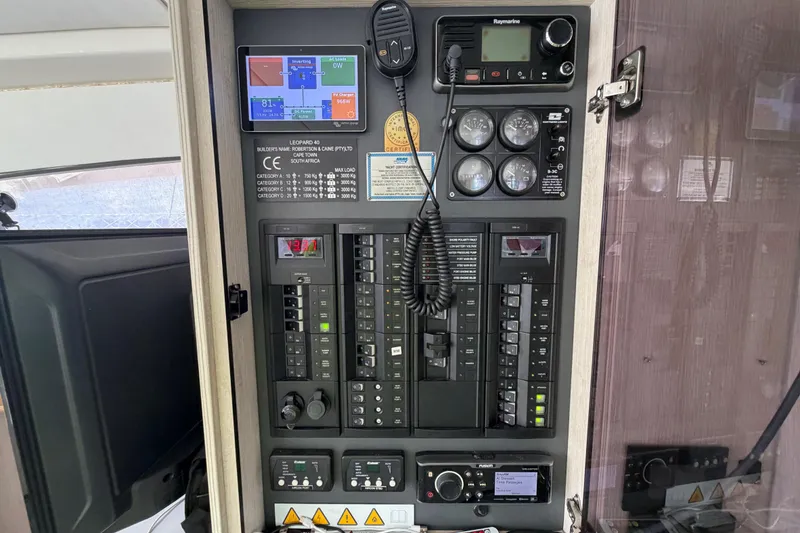 Slide: The Image of Control panel of a 2017 Leopard 40 yacht with navigation and communication equipment. - 100
