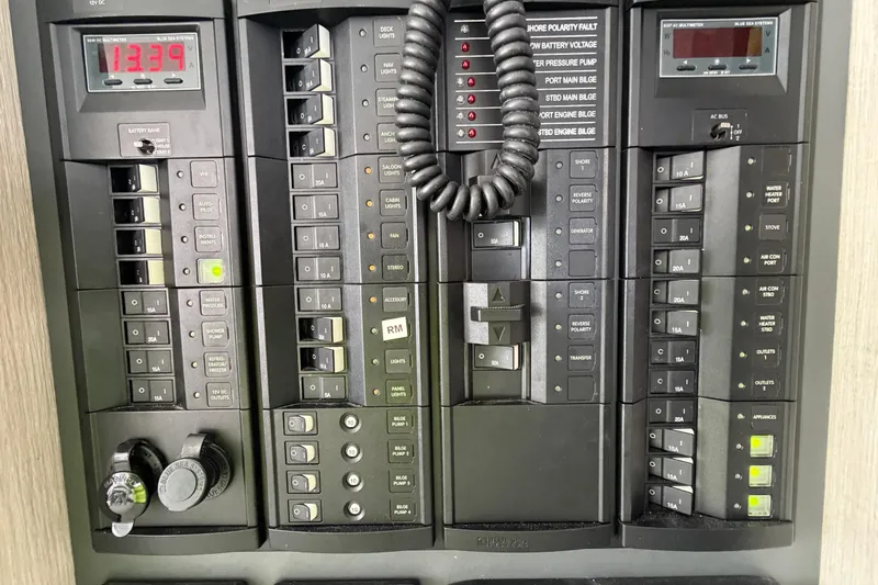 Slide: The Image of Electrical control panel of a 2017 Leopard 40 catamaran, featuring switches and meters. - 101