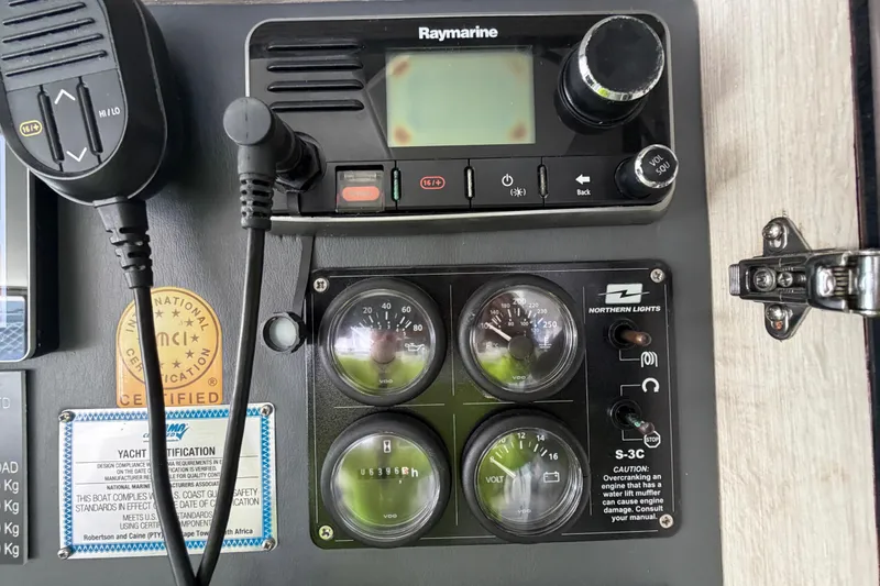 Slide: The Image of Control panel of a 2017 Leopard 40 yacht with Raymarine and Northern Lights equipment. - 102
