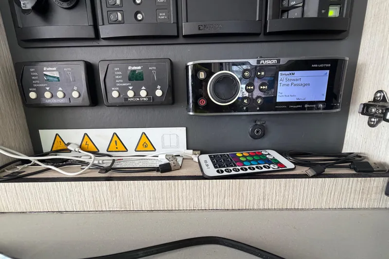 Slide: The Image of Control panel of a 2017 Leopard 40 yacht with audio system and air conditioning controls. - 104