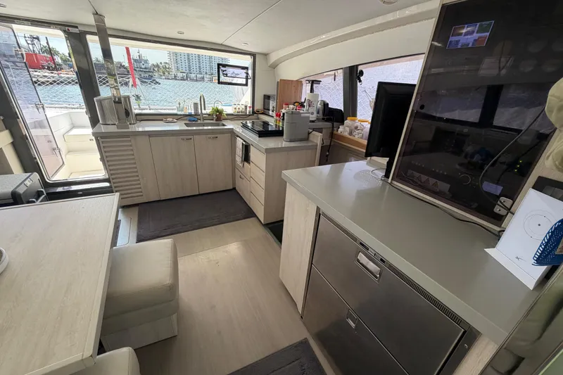 Slide: The Image of Modern kitchen interior on a 2017 Leopard 40 catamaran, featuring sleek cabinetry and appliances. - 106