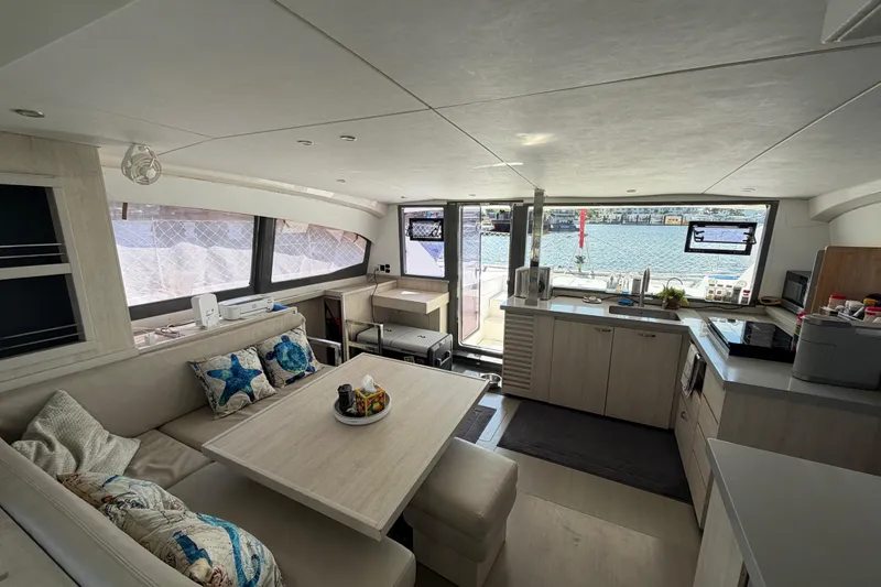 Slide: The Image of Luxurious interior of a 2017 Leopard 40 catamaran with modern kitchen and dining area. - 107