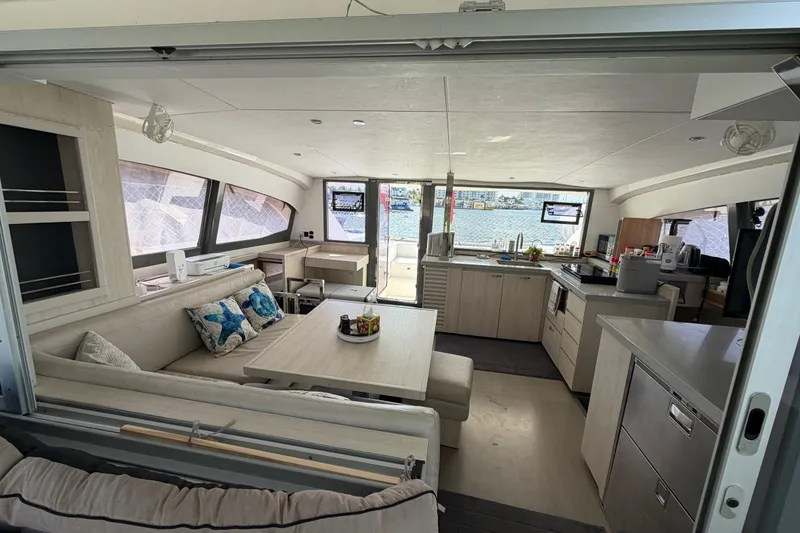 Slide: The Image of Luxurious interior of a 2017 Leopard 40 catamaran with modern kitchen and seating area. - 108
