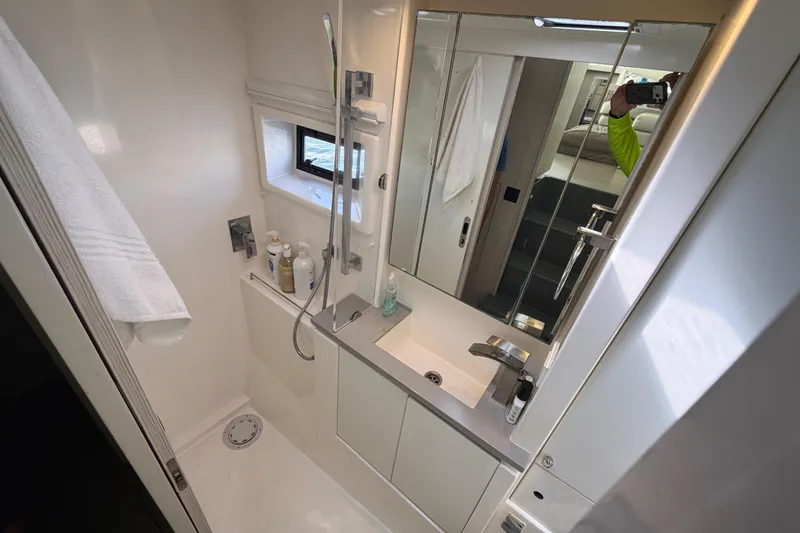 Slide: The Image of Modern bathroom in a 2017 Leopard 40 yacht, featuring sleek fixtures and ample storage. - 112
