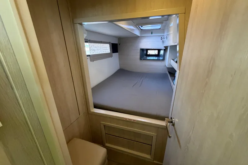 Slide: The Image of Interior cabin of 2017 Leopard 40 catamaran, featuring a cozy bed and modern design. - 116